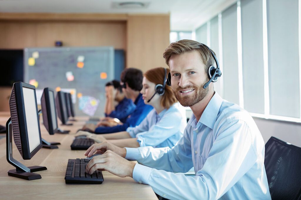 Faster customer support Support agent with a headset at a help desk, faster support for domain and hosting